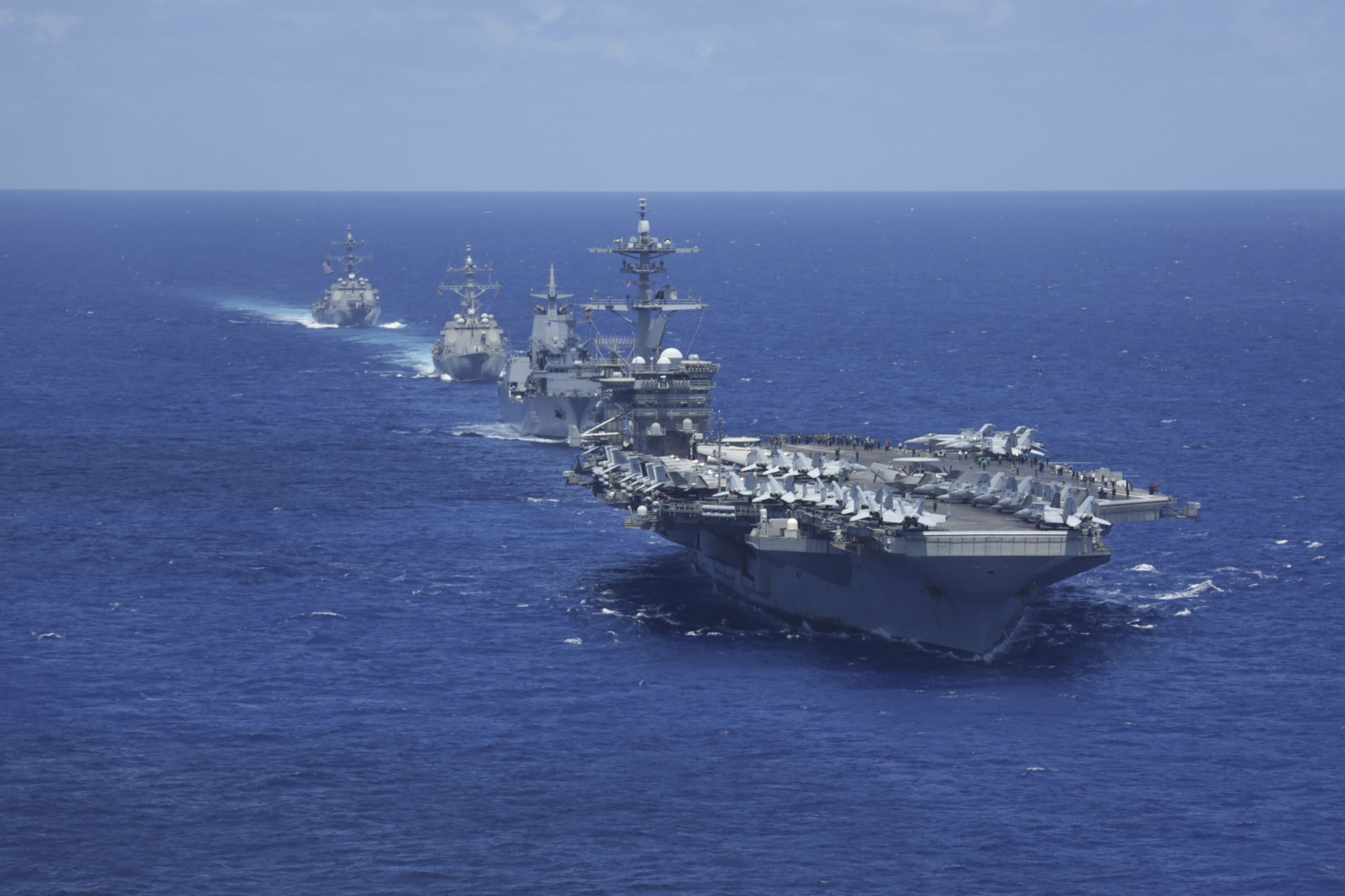 220623-N-DF558-1791 PACIFIC OCEAN (June 23, 2022) Nimitz-class aircraft carrier USS Abraham Lincoln (CVN 72), Royal Australian Navy auxiliary oiler replenishment ship HMAS Supply (AO 195), Arleigh Burke-class guided-missile destroyer USS Gridley (DDG 101) and Arleigh Burke-class guided-missile destroyer USS Spruance (DDG 111) sail in formation with Abraham Lincoln Carrier Strike Group (ABECSG), Japan Maritime Self-Defense Force and RAN ships. ABECSG is underway conducting routine operations in the U.S. 3rd Fleet. An integral part of U.S. Pacific Fleet, U.S. 3rd Fleet leads naval forces in the Indo-Pacific and provides the realistic, relevant training necessary to flawlessly execute our Navy’s role across the full spectrum of military operations—from combat operations to humanitarian assistance and disaster relief. U.S. 3rd Fleet works together with our allies and partners to advance freedom of navigation, the rule of law, and other principles that underpin security for the Indo-Pacific region.(U.S. Navy photo by Mass Communication Specialist Seaman Aleksandr Freutel)