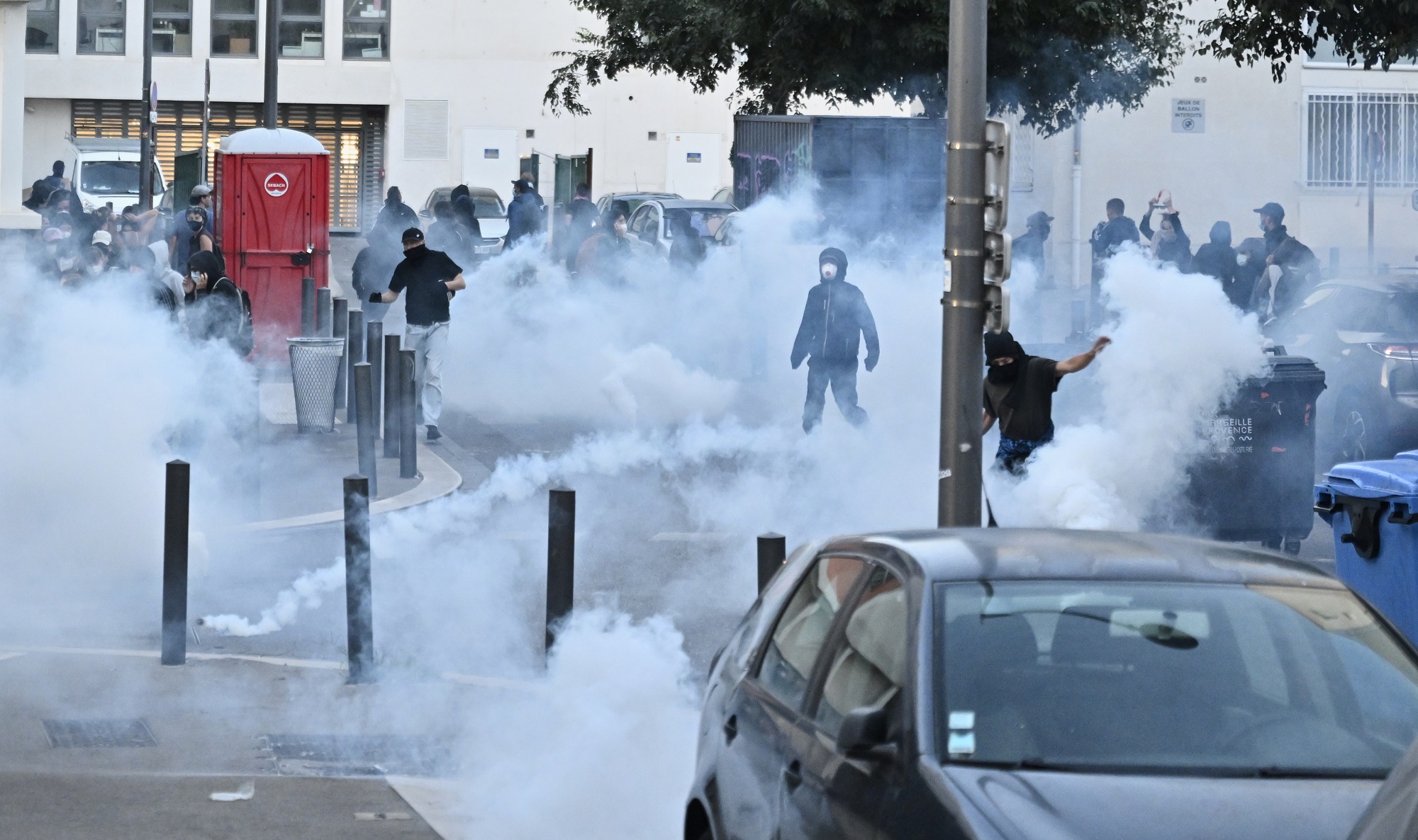 French police fire tear gas grenades to protesters during a gathering of the "Block Everything" movement in Marseille, south of France, Wednesday, Sept. 10, 2025. (AP Photo/Philippe Magoni)