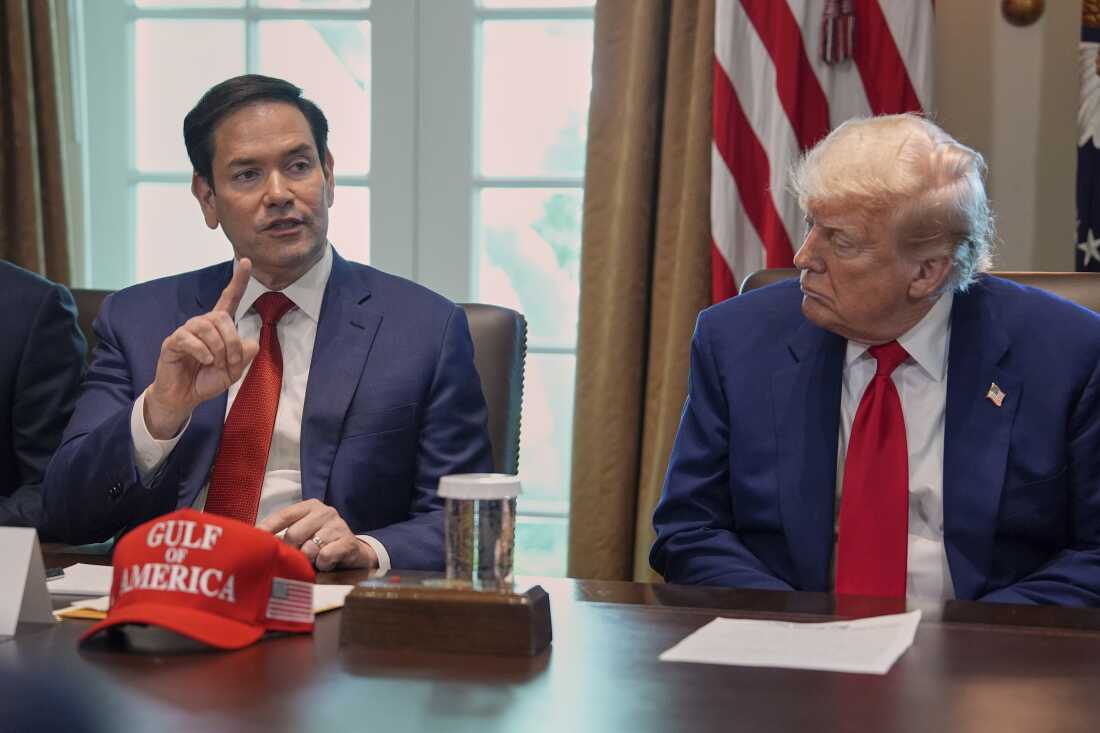 Secretary of State Marco Rubio speaks during a cabinet meeting at the White House, Wednesday, April 30, 2025, in Washington, as President Donald Trump look on. (AP Photo/Evan Vucci)